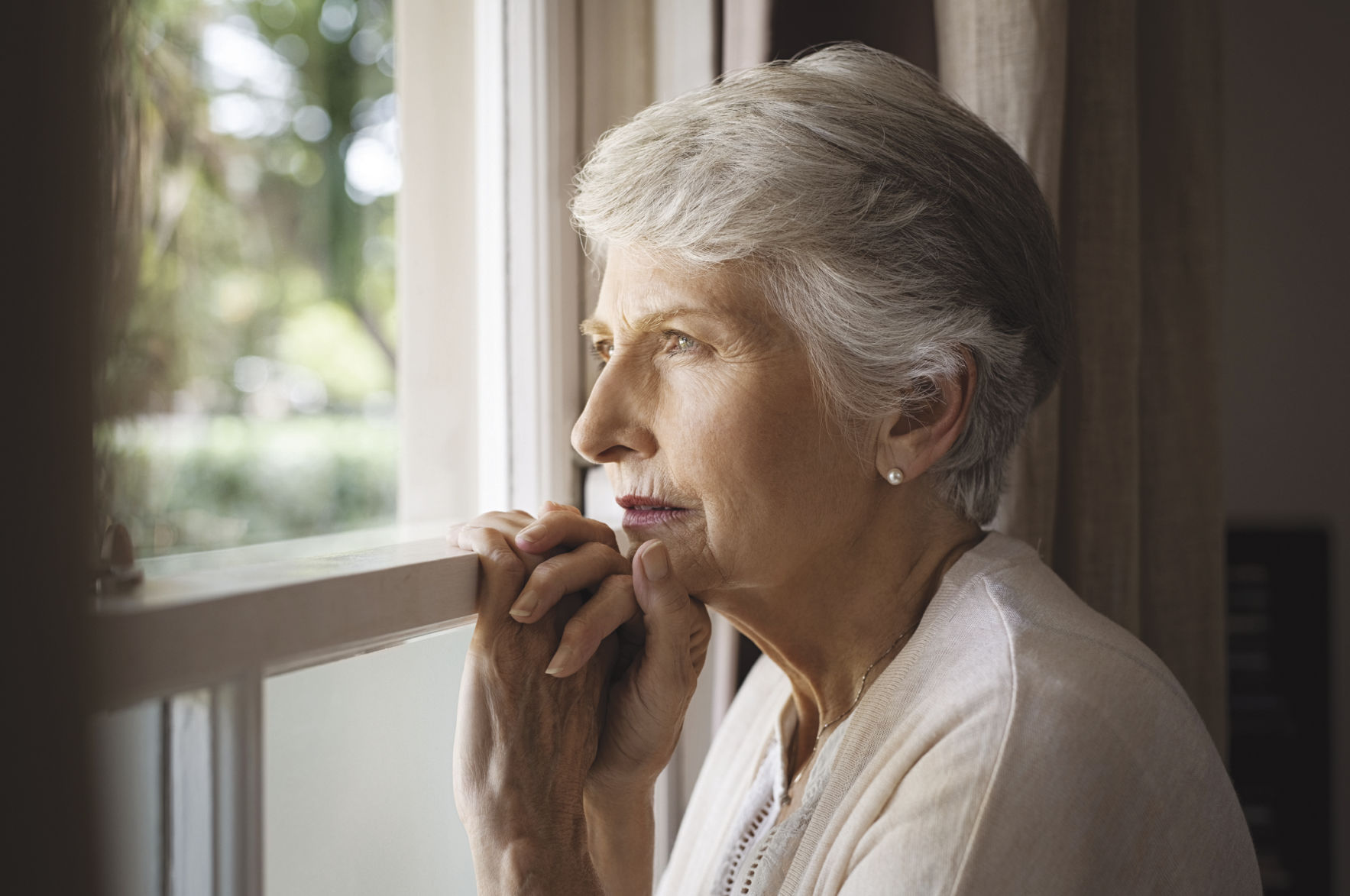 STOCK woman looking out window